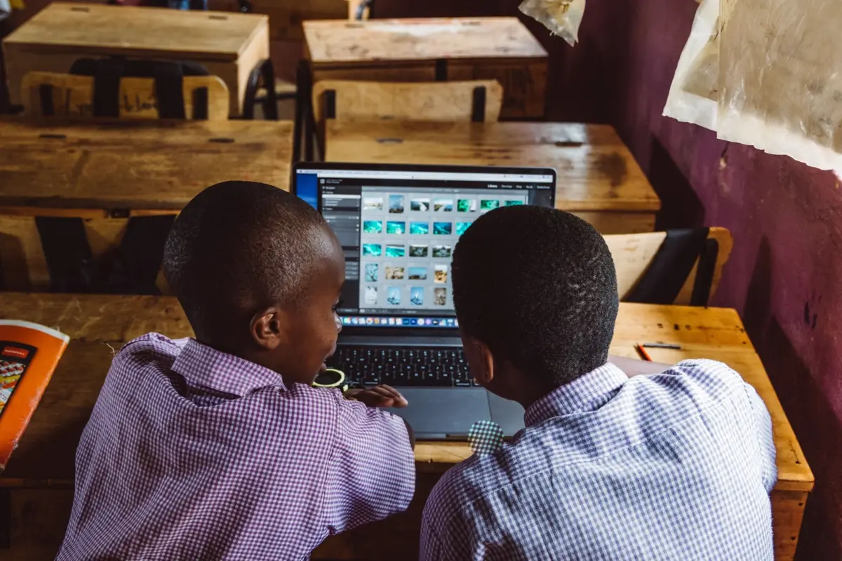 Two pupils working together on a laptop in their classroom